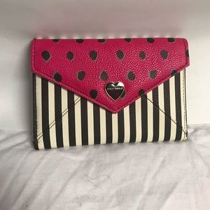 Betsey Johnson pink striped passport wallet.